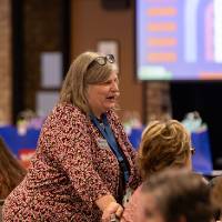 person standing and talking photo 2